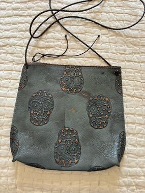 B. May Embossed Skull Crossbody bag
